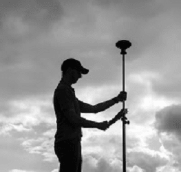 Silhouette of a Man Holding a Hybrid+