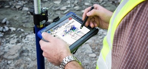 Hands Holding an RT4 Rugged Tablet