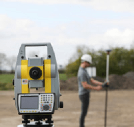 Man Using Surveyor Equipment